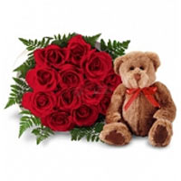 Beautiful Roses along with a Bear....