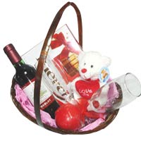 Soft toy, pralines, a small bottle of red wine, ca...