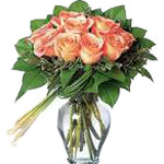 Peach Roses Arranged in a Beautiful Vase With a Co...