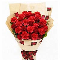 12 red roses, 16 red carnations and greens, light brown package, beautiful packa...