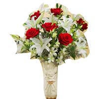 12 red roses, 3 white lilies, arranged in the pretty glass vase. (The picture is...