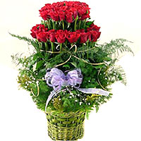 Greet your dear ones with this Distinctive Red Roses Arrangement in a Basket and...