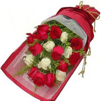 12 red roses and 6 white roses with greens, white ...