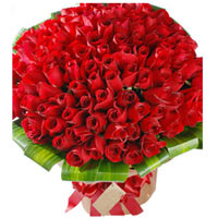 99 premium red roses, with green, and brown paper ...