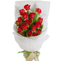 16 red roses, match greenery, white guaze wrap. ...