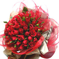50 red roses, match greenery, red gauze to wrap....
