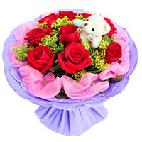 9 red roses and a cute bear beautiful hand banquet....