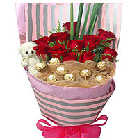 11 red roses with 8 chocolate and a little lovely bear, matched with greens, bea...