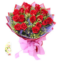 19 red roses with greens, light purple and red pacakge....