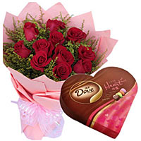 11 red roses with green stuff, pink package. A heart box of dove brand chocolate...
