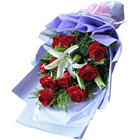 9 red roses and 1 stem white lily with greens, hand banquet with light purple pa...