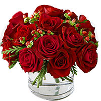 18 red roses, match greenery, arrange in glass vase. Great festival flowers....