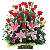 18 red roses, 3 pink lilies, matc greenery and flowers, flower basket....