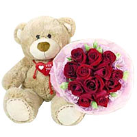 14 inches bear and 12 red roses with pink flowers handbouquet....