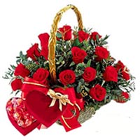 19 red roses with greenery, a box of chocolate....