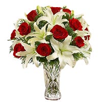 12 red roses and 4 stem white lilies with greens, vase....