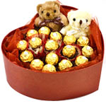 16 chocolate with 2 little bears,arranged in a hea...