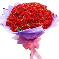 99 red roses, match baby's breath, purple crepe-pa......  to Zhengzhou