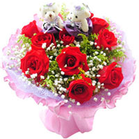 10 red roses with babybreath and greens, two littl......  to Beihai