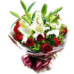 11 red roses, 2 white lilies, with greens, red pac......  to Kuerle