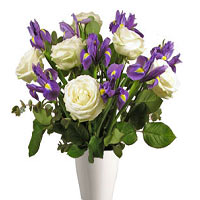 Blue-white combination of iris and roses make this...