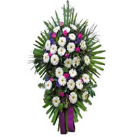 Combining gerbera and roses declare his last farewell dear deceased person. ...