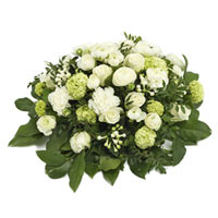 Round funeral spray in white and lime