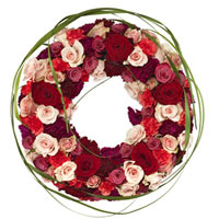 Round funeral wreath with roses