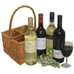 A Basket with a mix of 3 or 4 bottles of red and w...