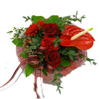 Tie all bouquets of fresh flowers after receiving the order. A bouquet of red an...