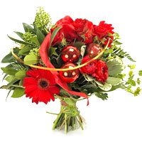 Bouquet of beautiful red hues with red roses, gerberas red, amaryllis, various g...