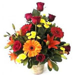 Our spring arrangement includes bright colored flo...