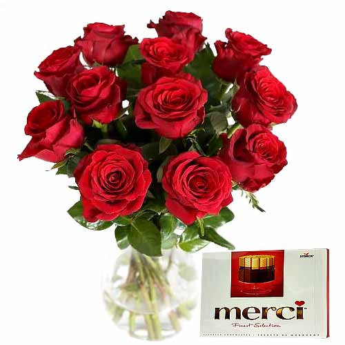 Stunning 12 Red Roses in Vase with Merci Chocolates