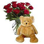 Cuddle teddy with beautiful 6 roses- a wonderful expression of ur specisl feelin...