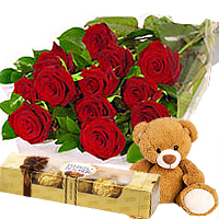 Lavish Arrangement of 12 Fresh Red Roses with Lip-smacking Ferrero Rocher Chocolates and Endearing Teddy Bear