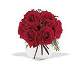 Open red roses with a vase.