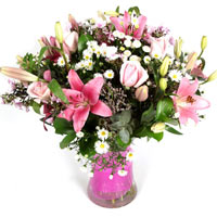 All pink Spring bouquet made with pink  lilies, asters, Limonium and roses, happ...