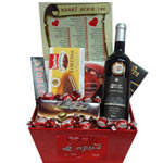 Adorable Assorted Chocolate N Red Wine Gift Hamper