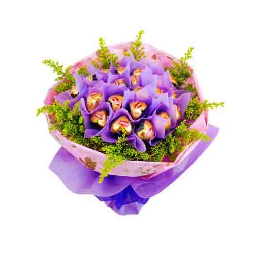 Impress someone with this Toothsome Blooming Love Chocolate Bouquet that is not ...