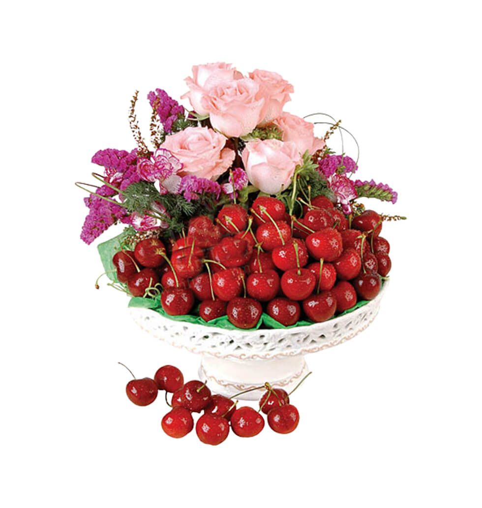These roses and cherries in a basket are sure to i...