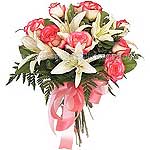 Round short stemmed bouquet of mostly pink flowers...