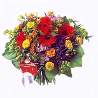 Beautiful basket of mixed seasonal flowers mostly in yellow and white colours (t...