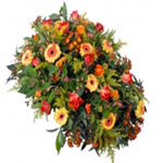 Enchanting Forever Remembered Oval Shaped Orange and Yellow Flowering Bouquet