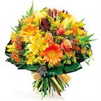 Round bouquet of varied flowers, mostly yellow and...