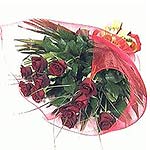 A hand-tied bouquet of 12 beautiful red roses with fresh greenery and gift-wrapp...