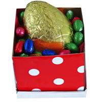 Selection of Easter Eggs present in a colourful bo...