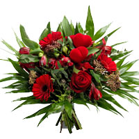 A romantically festive, pure red bouquet of roses and a few supporting cast memb...