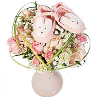 A sweet bouquet for a baby girl with lovely pink slippers and matching vase. The...