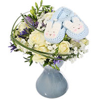 A sweet bouquet for a boy baby with beautiful blue slippers and matching vase. T...