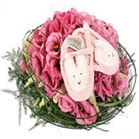 A cute decoration for a baby girl with lovely pink slippers. The decoration is m...